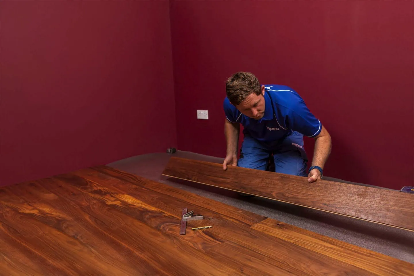 Aspect floor fitters installing engineered floorboard floor