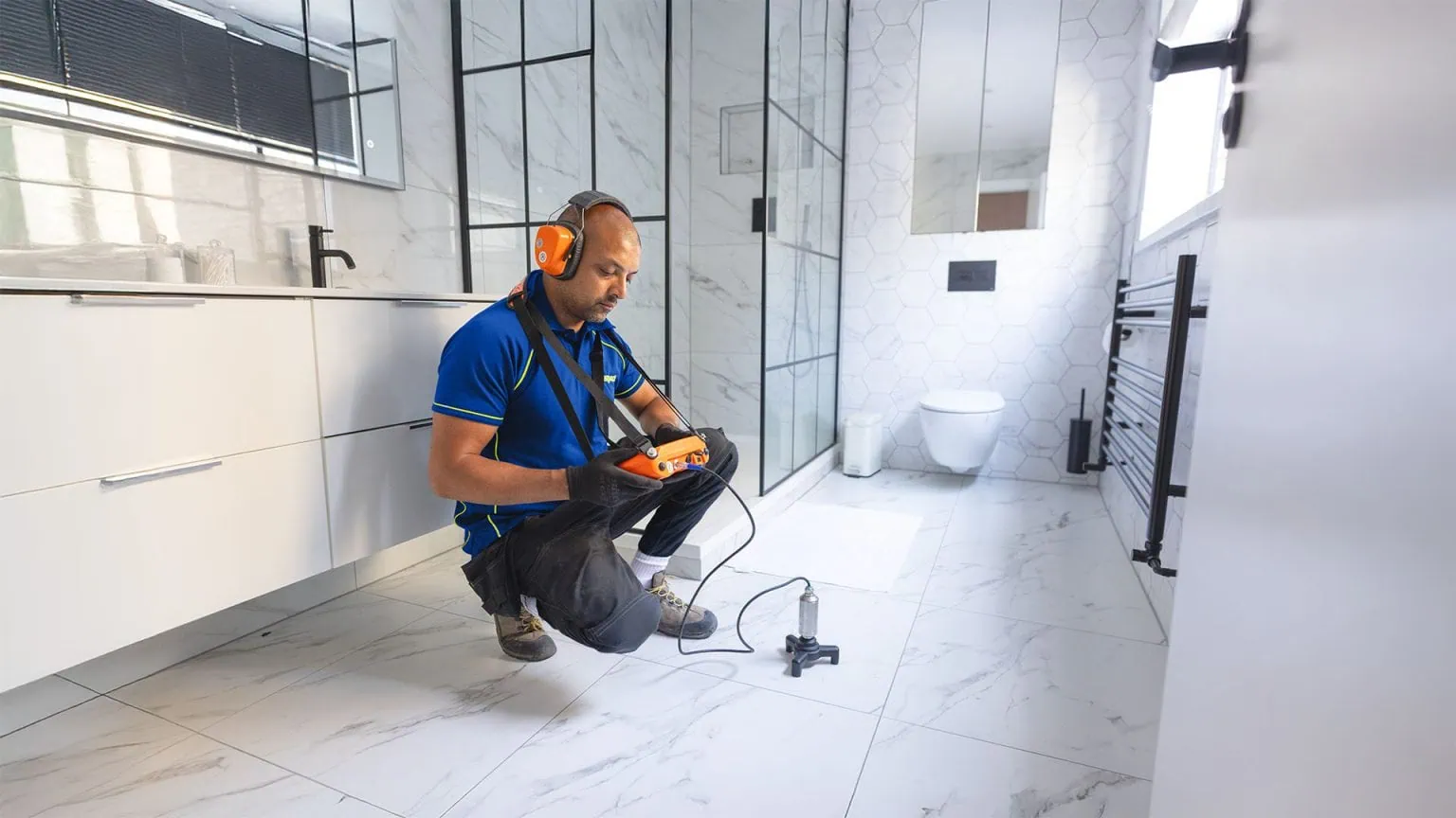 Plumbing leak detection by an Aspect tradesperson using an acoustic test in a bathroom
