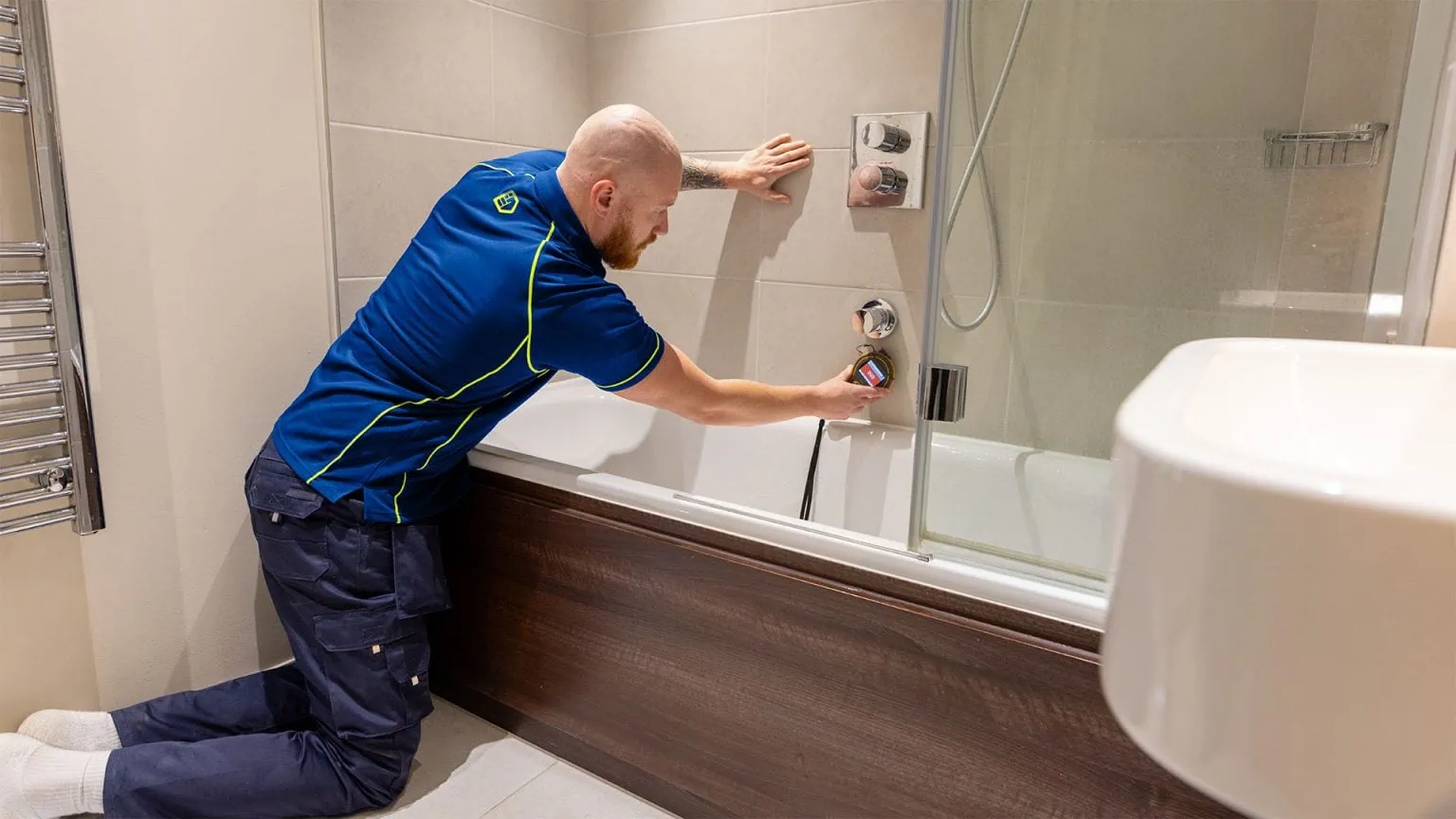 Shower leak detection by an Aspect tradesperson using a moisture meter